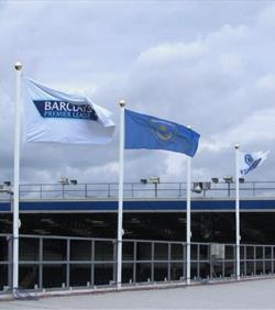 flags and flagpoles on the stadium roof at Portsmouth football club