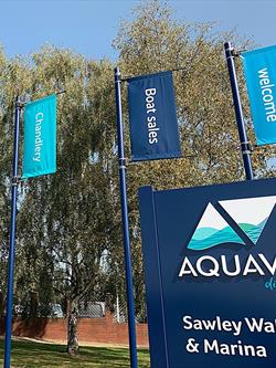 blue banner mast outside a sailing club