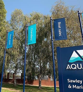 blue banner mast outside a sailing club