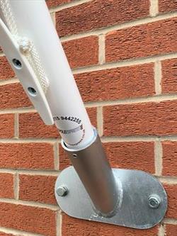 flagpole angled bracket on a wall