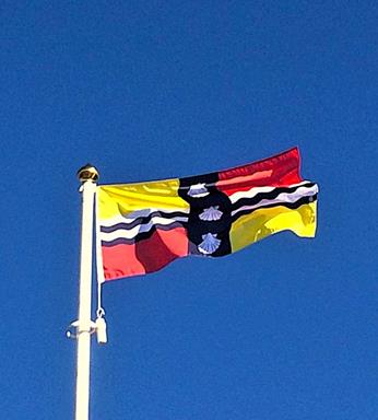 Bedfordshire county flag flying from a flagpole
