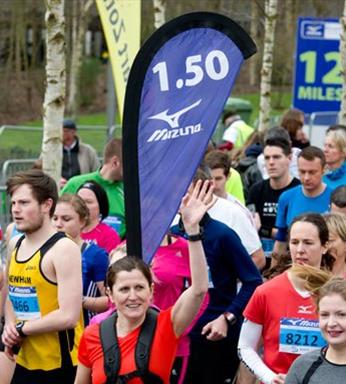 backpack flag in crowd of runners