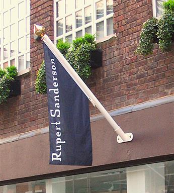 printed angled flag on a shop front