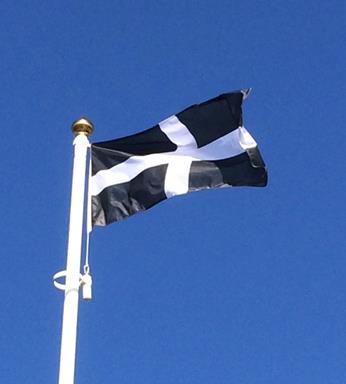 Cornwall flag otherwise known as the Cornish flag flying from a flagpole