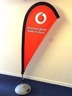 Tear drop feather flag on free standing water base with voda phone flag 