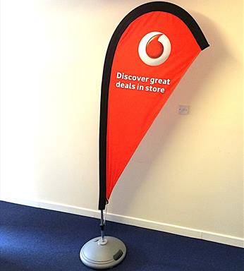 Tear drop feather flag on free standing water base with voda phone flag 