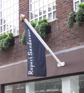 angled flag pole on wall