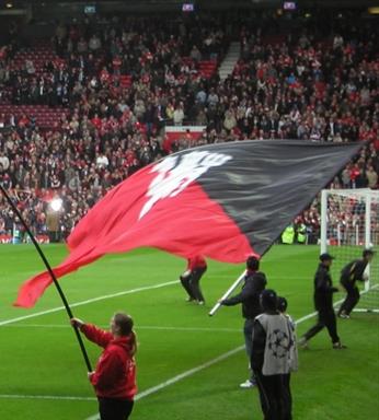 someone with a hand held flagpole and flag