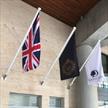 three flagpoles with white finials