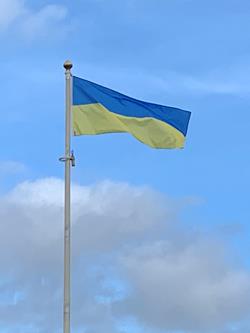 Hand sewn Ukraine flag flying from a flagpole